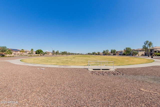 view of home's community featuring a yard and a residential view