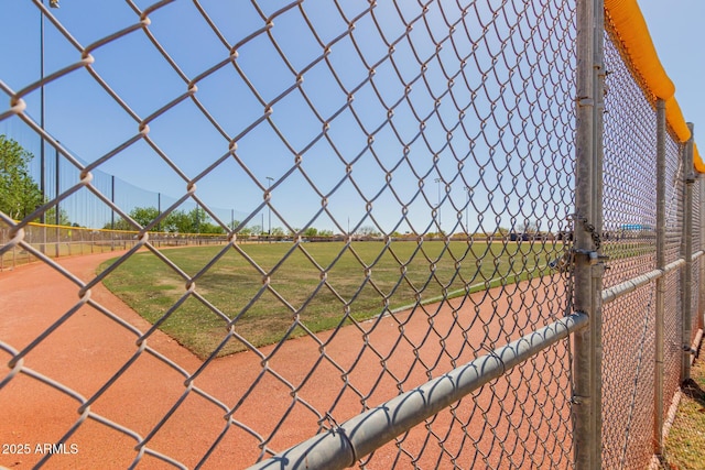 view of sport court featuring fence