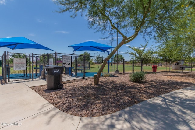 view of playground with fence and a gate