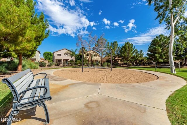 view of property's community with playground community and volleyball court