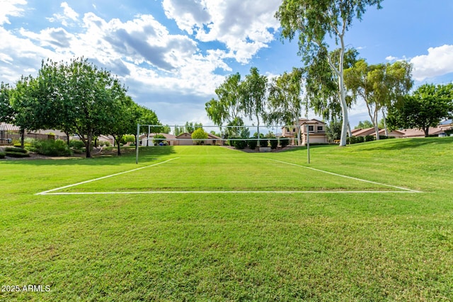 view of home's community with fence