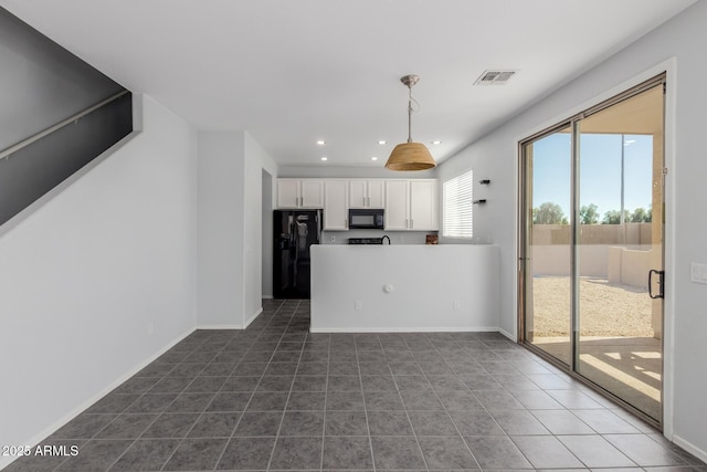 kitchen with visible vents, black appliances, recessed lighting, white cabinetry, and dark tile patterned flooring