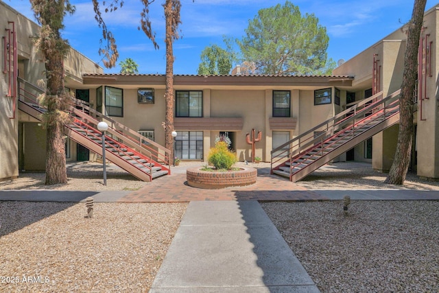 view of home's community with stairs