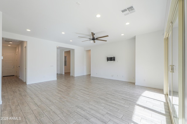 unfurnished room with ceiling fan