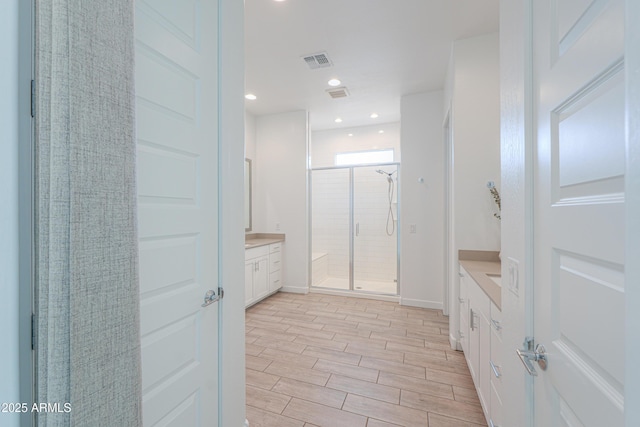 bathroom with vanity and walk in shower