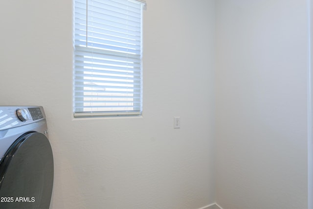 washroom with washer / clothes dryer