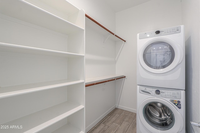 washroom with stacked washer and clothes dryer