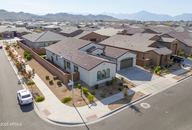 birds eye view of property with a mountain view