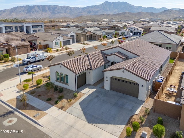 birds eye view of property with a mountain view