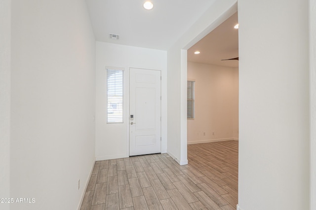 entrance foyer with ceiling fan