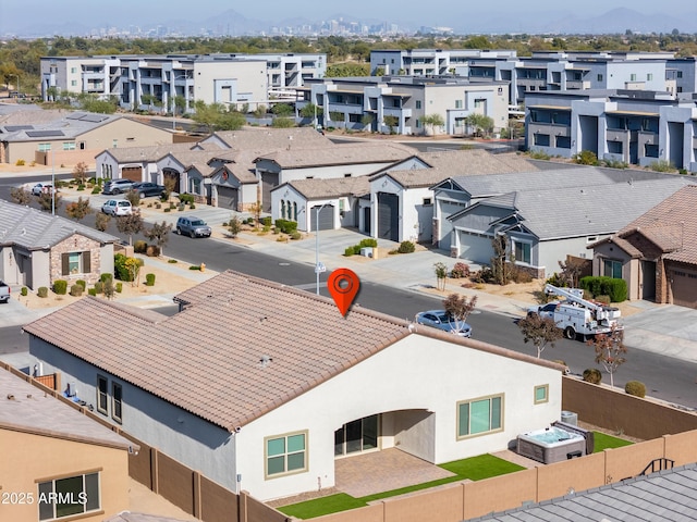 birds eye view of property with a mountain view