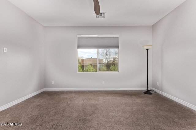 unfurnished room with ceiling fan and carpet flooring