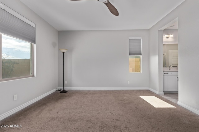 carpeted empty room with ceiling fan