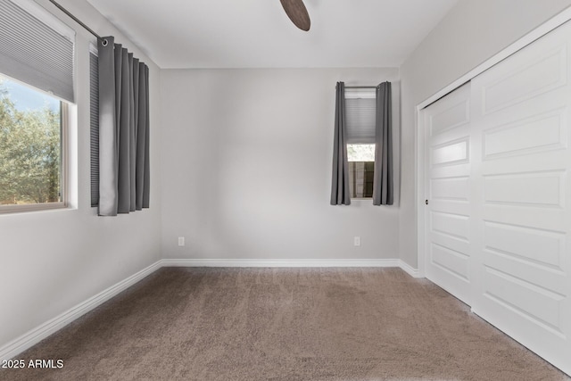 unfurnished room featuring carpet flooring and ceiling fan