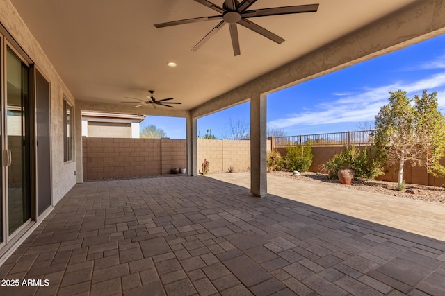 view of patio featuring ceiling fan