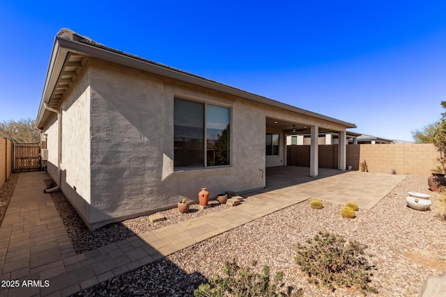 back of house with a patio