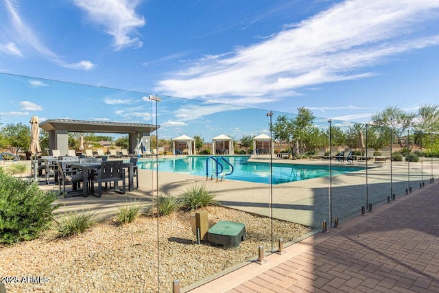 view of swimming pool featuring a gazebo and a patio