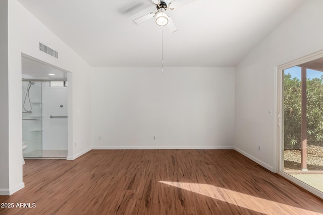 spare room with hardwood / wood-style flooring, ceiling fan, and vaulted ceiling