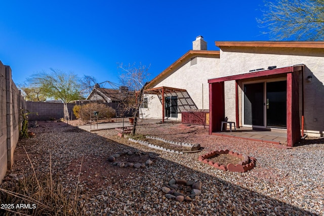 rear view of house with a patio