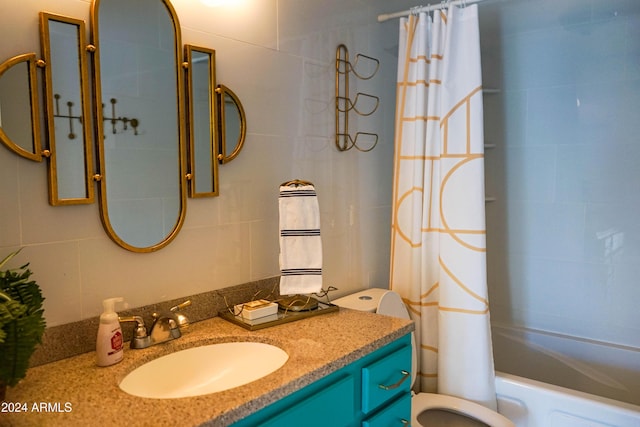 full bathroom featuring vanity, toilet, and shower / bath combo with shower curtain