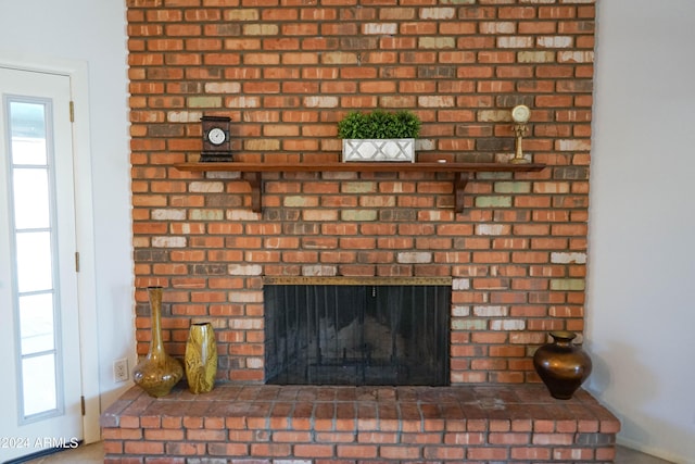 details with a brick fireplace