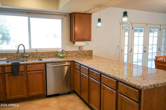 kitchen with dishwasher, sink, kitchen peninsula, decorative light fixtures, and light tile patterned floors