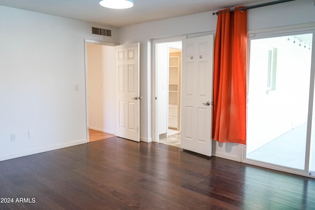 spare room featuring dark hardwood / wood-style floors