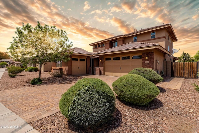 3338 E Coconino Dr, Gilbert, AZ 85298 - prairie-style home featuring an attached garage, driveway, stucco siding, and a tile roof