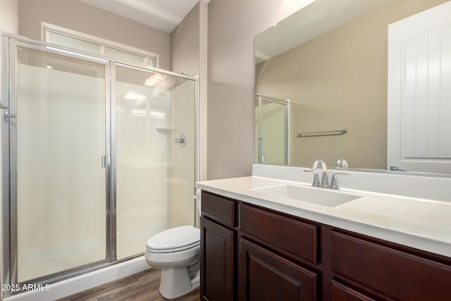 3338 E Coconino Dr, Gilbert, AZ 85298 - bathroom featuring wood finished floors, a shower stall, and vanity