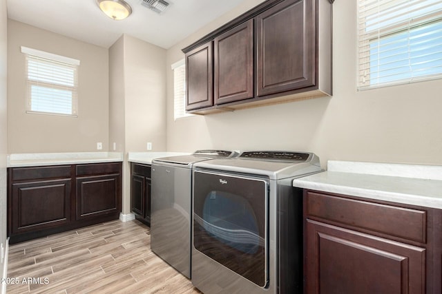 3338 E Coconino Dr, Gilbert, AZ 85298 - laundry area with cabinet space, washing machine and dryer, and light wood finished floors