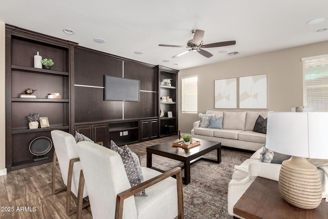 3338 E Coconino Dr, Gilbert, AZ 85298 - living area featuring healthy amount of natural light, ceiling fan, wood finished floors, and built in shelves