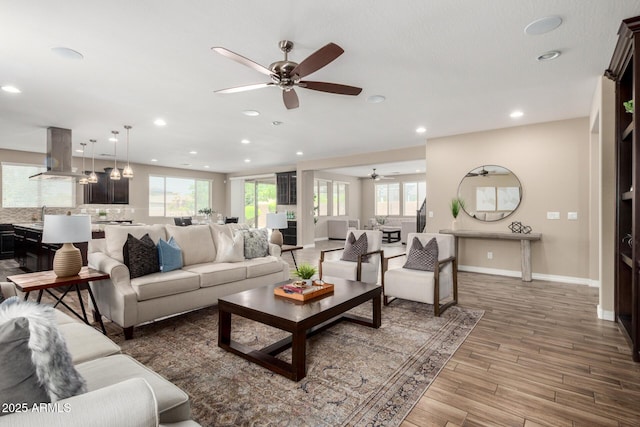 3338 E Coconino Dr, Gilbert, AZ 85298 - living area featuring ceiling fan, plenty of natural light, recessed lighting, and wood finished floors