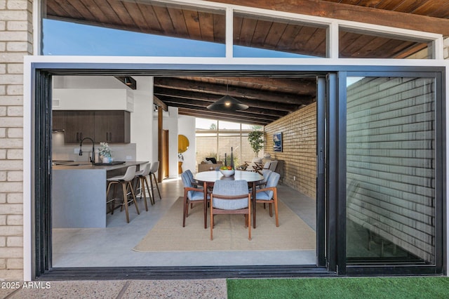 view of patio / terrace featuring a wet bar