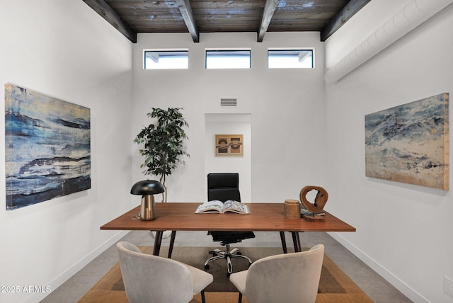 home office with beamed ceiling, wooden ceiling, and a wealth of natural light