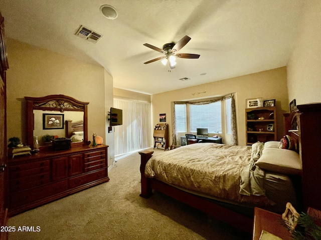 bedroom featuring ceiling fan and carpet