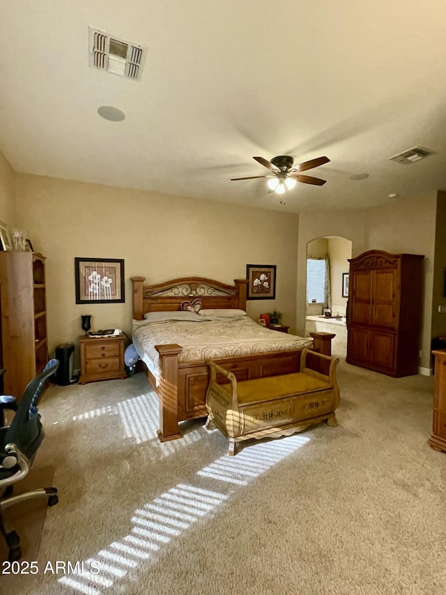 bedroom with ceiling fan and light carpet