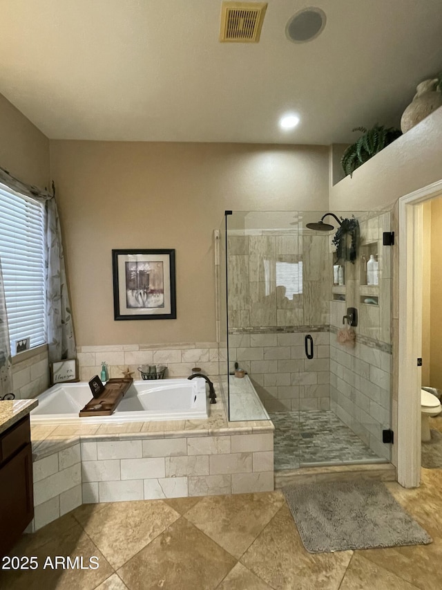 full bathroom with toilet, vanity, and shower with separate bathtub