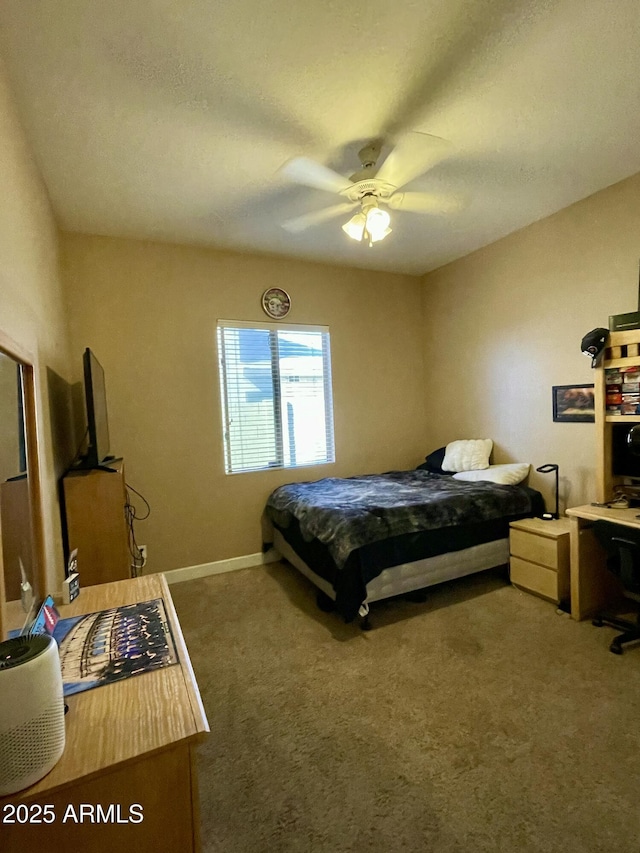 bedroom with ceiling fan and carpet