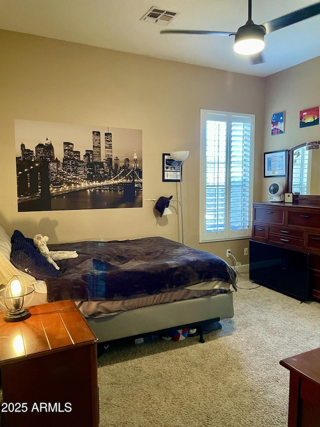 bedroom with ceiling fan and carpet flooring