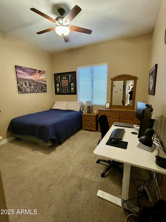 bedroom featuring ceiling fan and carpet