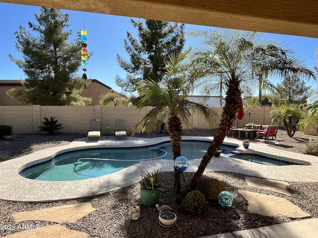 view of pool with an in ground hot tub and a patio area