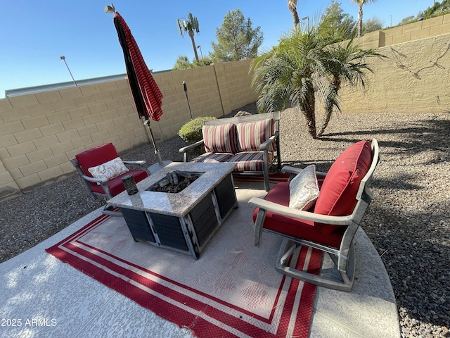 view of patio / terrace with an outdoor fire pit