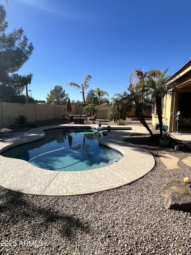 view of pool featuring a patio area