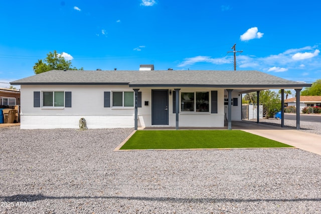 6316 N 23rd Ave, Phoenix, AZ 85015 - ranch-style house featuring concrete driveway, a front yard, a shingled roof, and an attached carport