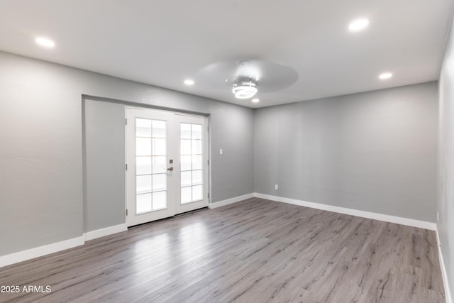 6316 N 23rd Ave, Phoenix, AZ 85015 - spare room with a ceiling fan, recessed lighting, wood finished floors, baseboards, and french doors