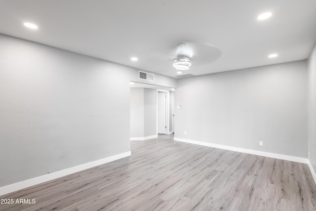 6316 N 23rd Ave, Phoenix, AZ 85015 - spare room with wood finished floors, recessed lighting, and baseboards