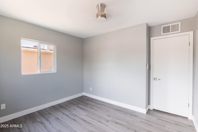 6316 N 23rd Ave, Phoenix, AZ 85015 - spare room with light wood-type flooring and baseboards