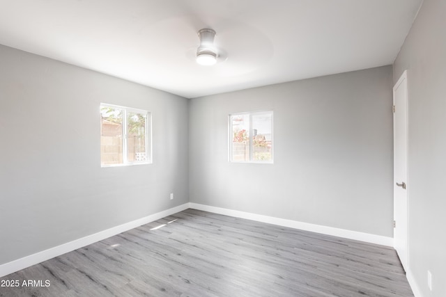 6316 N 23rd Ave, Phoenix, AZ 85015 - spare room featuring wood finished floors, a ceiling fan, and baseboards
