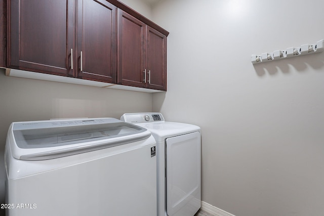809 W Coles Rd, Phoenix, AZ 85041 - washroom with cabinet space, washer and clothes dryer, and baseboards