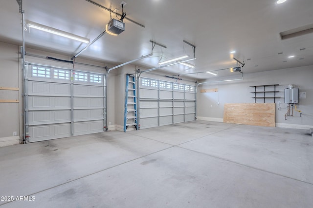 809 W Coles Rd, Phoenix, AZ 85041 - garage with a garage door opener, baseboards, and water heater